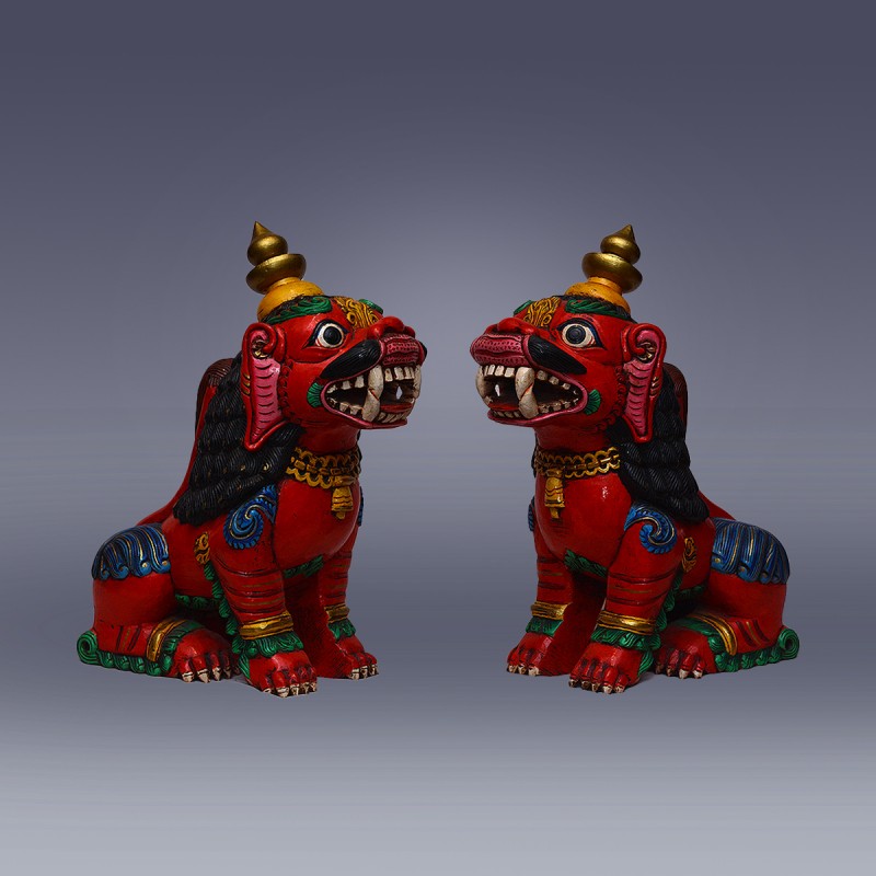 wooden lion, slanted facing each other