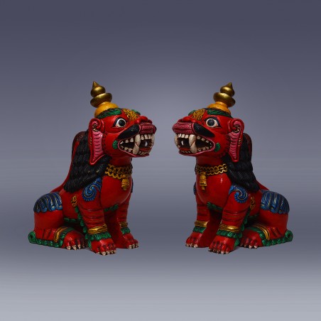wooden lion, slanted facing each other