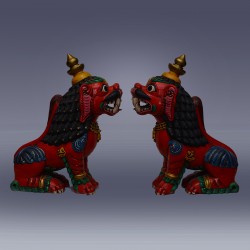 wooden lion, facing each other